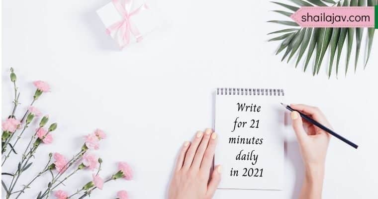 Pink flowers and leaves against a white background. Hand holding a pencil poised over a notepad with the text Write for 21 minutes daily in 2021