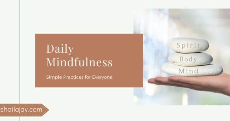 Hand holding stones with the words body, mind and soul written on them signifying daily mindfulness practices for a healthy mindset